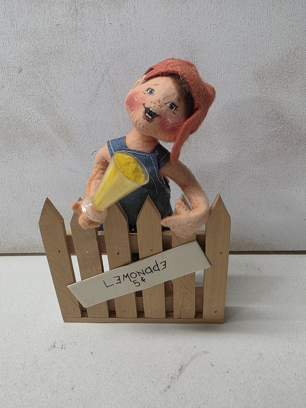 Annalee felt doll with coral hat and yellow megaphone